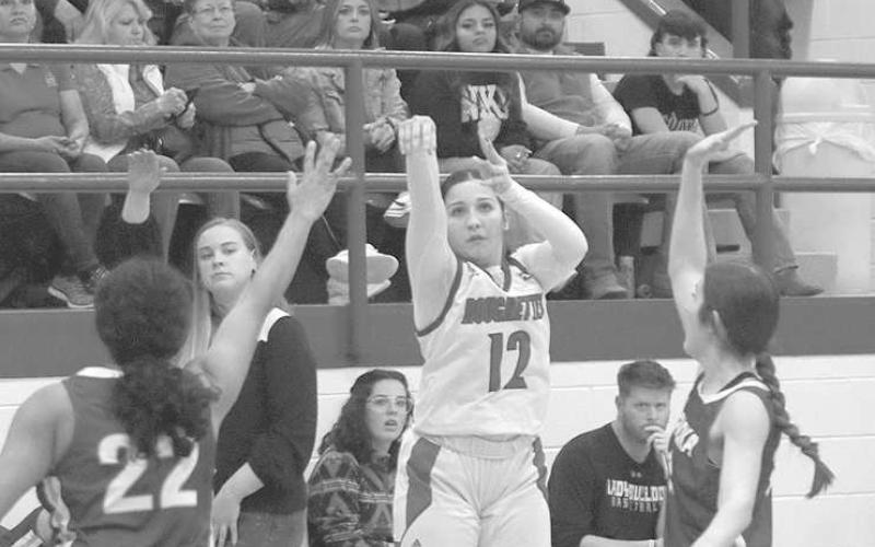 THREE- The Sundown Roughettes hosted Tahoka Friday night and ended the season with a lopsided 6333 victory to finish second in the district. Kaydence Loftin knocked three of her eight points from behind the arc. (Photo Courtesy of Chris Bratcher)