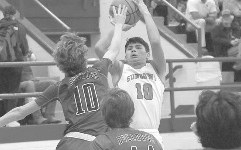 QUICK RELEASE- The Sundown Roughnecks lost a home game to the Tahoka Bulldogs Friday night, 6246. Noah Peralez got off a three-pointer before of a defender could block his shot. Sundown is currently third in district with a shot at the playoffs if they can defeat Plains on Friday night Ropes on the road next Tuesday. (Photo Courtesy of Chris Bratcher)