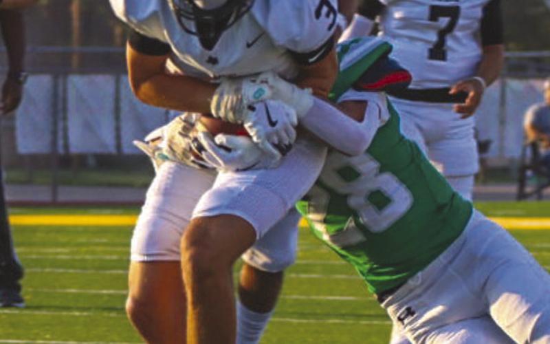 TOO STRONG - Lobo Gage Potter ran with the ball breaking tackles from the Idalou defense this past Friday on the road. The Lobos faced off against the Brownfield Cubs this past Friday. (Staff photo by Aalijah Soliz)