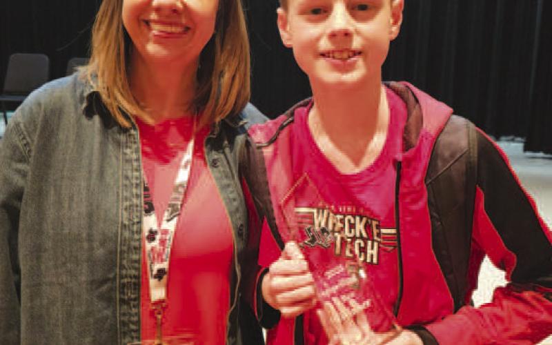 SPELLING GURU - LMS sixth-grader Caleb Willey participated in the Regional Spelling Bee last Saturday and earned 4th place. Caleb has won the Levelland ISD District Bee three years in a row and has participated in the Regional Bees as many times. Pictured is Caleb Wiley alongside LMS Spelling Bee Chair and Librarian Mixie Clowe. (Photo courtesy of Cristal Isaacks)