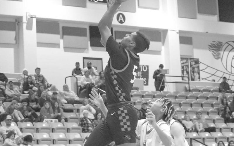 VERTICAL - Levelland Lobo Sean Landrum made the athletic lay-up during the teams away game against the Andrew Mustangs this past Tuesday night. (Staff photo by Aalijah Soliz)