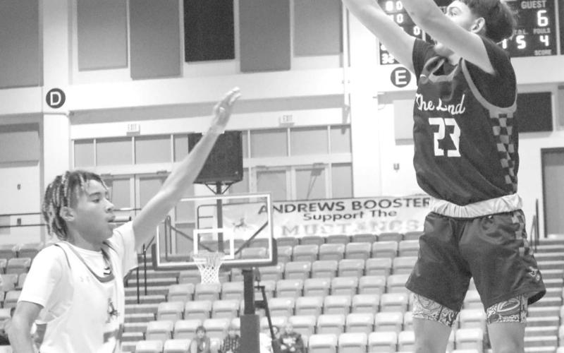 DEEP - Levelland Lobo Ozzie Salano shot the ball from the corner for a Lobo three during the teams away game against the Andrew Mustangs last Tuesday night. The Lobos competed at the Denver City Tournament this past weekend against teams in the area. (Staff photo by Aalijah Soliz)
