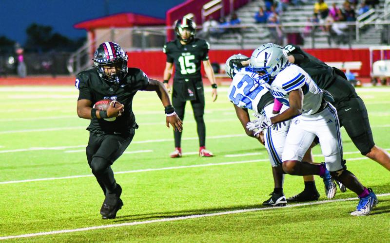 MARTIN ON THE RUSH - Sophomore running back Noah Martin rushes the ball for Levelland during a game against Estacado this past Friday night at Lobo Stadium. Martin would finish with seven carries for 45 yards and a touchdown in the Lobos 20-13 loss. (Staff photo by Jentezen Smith)