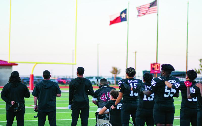 NATIONAL ANTHEM - The Levelland Lobos coaches and players all stand in line for the National Anthem at Lobo Stadium before their game against Estacado this past Friday night. The Lobos would later go on to fall to Estacado 20-13. (Staff photo by Jentezen Smith)