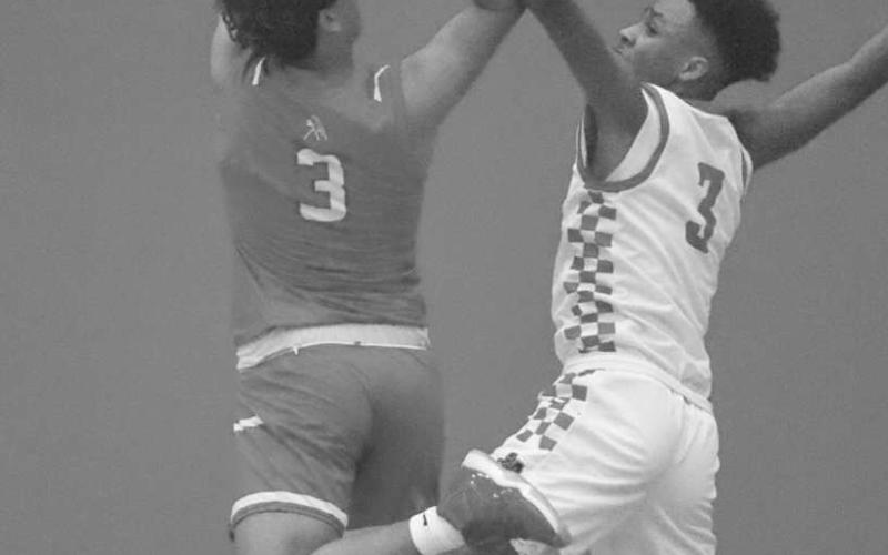 DEFENSE - Levelland Lobo Eryk Jones blocked the shot from the Sweetwater Mustangs during the team’s win last Tuesday night at home. (Staff photo by Aalijah Soliz)