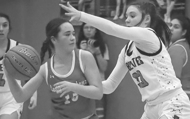 CLAMPED - Levelland Loboette Presley Smith guarded the Sweetwater player during the teams contest last Friday where the Loboettes made the Lady Mustangs work for every point. (Staff photo by Aalijah Soliz)