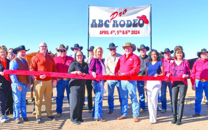 ABC RODEO - The Levelland Chamber of Commerce held a ribbon-cutting ceremony for the ABC Rodeo Wednesday for the event that lasted through the week. Pictured in no particular order are: Scott Taylor, Lorie Marquez, Janie Morales, Breann Buxkemper, Mike Loalker, King Norris, Barry Robinson, Earl Bratcher, Gene Nall, Gary White, Scotty Bowyer, Will Calfin, Raz Short, Crystal Isaacks, Mary Siders and Kelly Hancock. (Staff photo by Emily Campos)