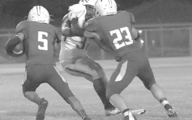 RIGHT AROUND YOU - Whiteface Antelope Tyler Campbell made a solid block to give Jose Flores room to run in a 60-0 home win over the Boys’ Ranch Roughriders in UIL high school six-man football action last Friday. The Antelopes will host no. 13 Klondike on Friday at 7:30 p.m. (Photo by Holly Crutcher)
