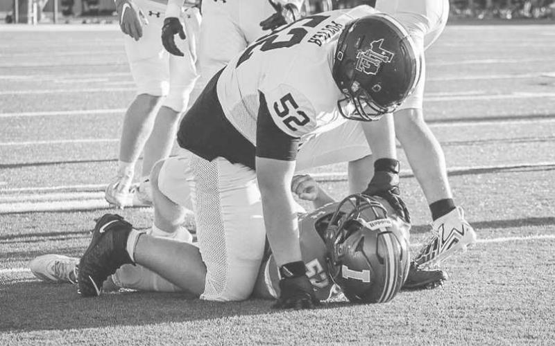 PANCAKE - Levelland Lobo Casen Potter drove his defender all the way to the ground this past Friday against the Idalout Wildcats on the road. (Staff photo by Aalijah Soliz)