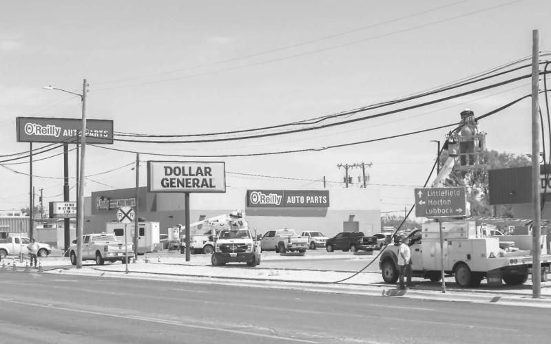 POWER LINE WORK - Crews were working on low hanging power lines and replacing the necessary line along College Avenue next to Oak Street on Wednesday. (Photo courtesy of Emily Campos)
