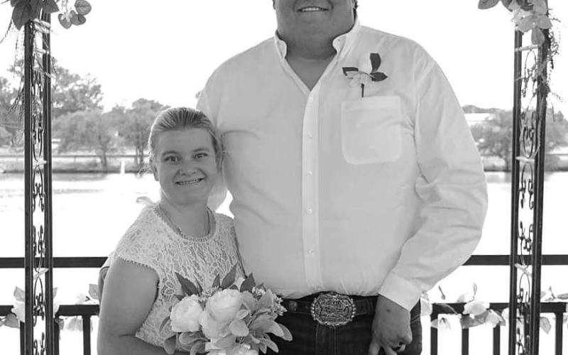 Mr. &amp; Mrs. Matt Bradley exchange wedding vows