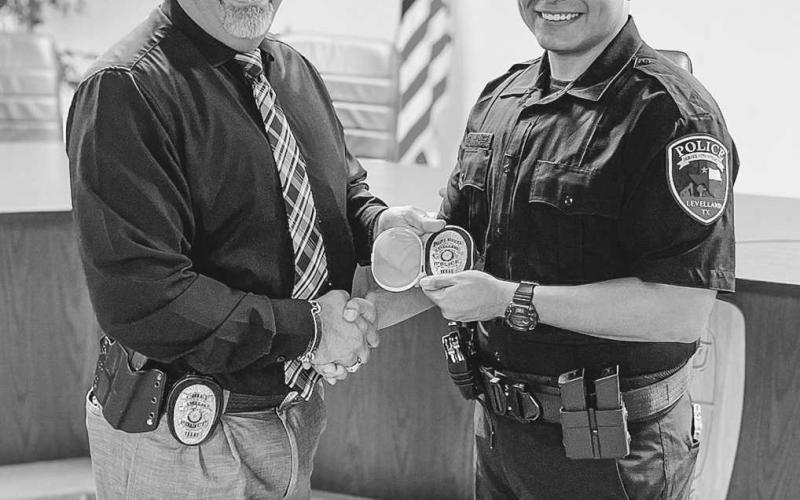 NEW ADDITION - The Levelland Police Department welcomed Officer Ernest Hernandez to their ranks Tuesday afternoon. Pictured is LPD Chief Albert Garcia and Officer Hernandez following his swearing into the department at Levelland City Hall. (Photo courtesy of Mateo Lopez)