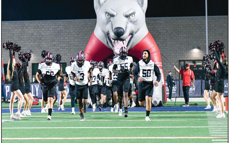 HEADED INTO ENEMY TERRITORY - The Levelland Lobos football team takes the field for their matchup against the Liberty Patriots this past Friday night on the road at Patriot Stadium. Levelland would fall to Liberty 49-10. (Staff photo by Jentezen Smith)