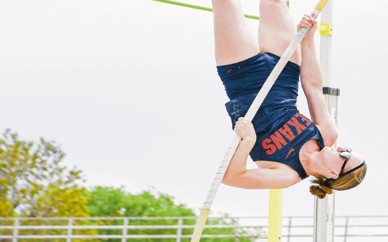 GOIN’ UPSIDE DOWN - SPC’s Olga Lapuzova goes upside down to clear the bar during the pole vault this past Friday at the SPC Alumni Elite Invitational at the SPC track complex. (Staff photo by Jentezen Smith)