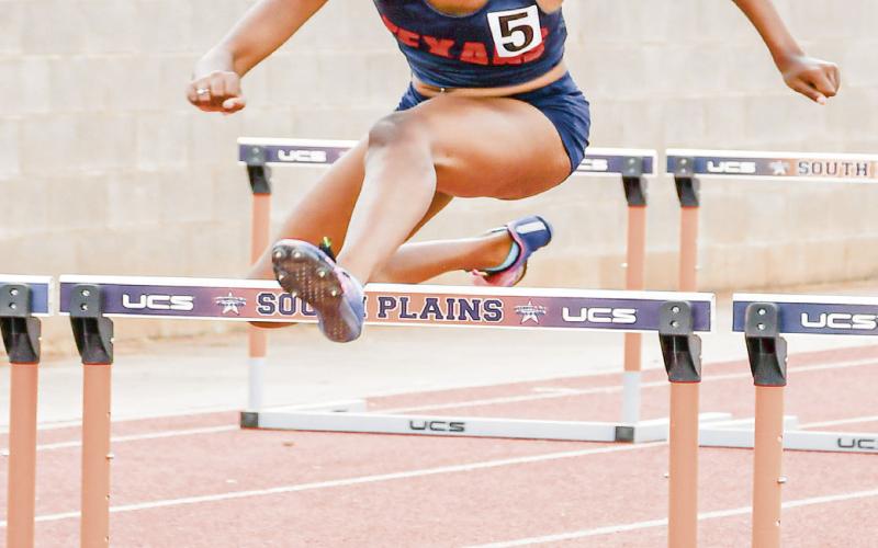 HURDLE FORM - SPC’s Ta’Nae Henderson clears a hurdles with good form during her 100-meter hurdles race this past Friday at the SPC Alumni Elite Invitational at the SPC track complex. (Staff photo by Jentezen Smith)