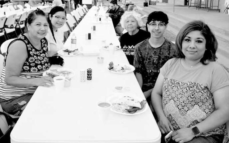 ENJOYING BREAKFAST-- Patricia Reyes, Jami Vela, Anita Salas, Jamie Cisneros and Jessica Reyes were enjoying some delicious bacon, eggs and pancakes at the Rotary’s Morning Breakfast that kicked-off the second annual Cotton &amp;amp; Crude Festival Saturday. (Submitted Photo by Delany Jackson)