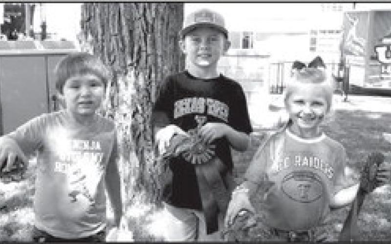 BEST DECORATED TURTLES-- The second annual Cotton &amp;amp; Crude Festival hosted its beloved annual turtle race as one of several events held throughout the day Saturday. Pictured from the left are the winners of the best decorated turtles with their awards: Benjamin Baigen and his tortoise “Otis” won the third place ribbon; Casey Daniel and his turtle “Venom” won the first place ribbon; and Jayde Daniels and “Rainbow Queen” won the second place ribbon. (Submitted Photo by Delany Jackson)