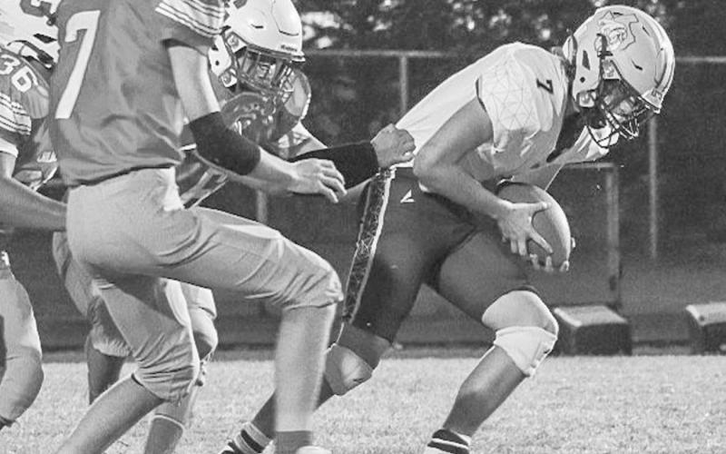 TOUGH RUNNING - Anton Bulldog Caleb Carlock ran through arm tackles last Thursday against the Chillicothe Eagles in Motley County. (Staff photo by Aalijah Soliz)