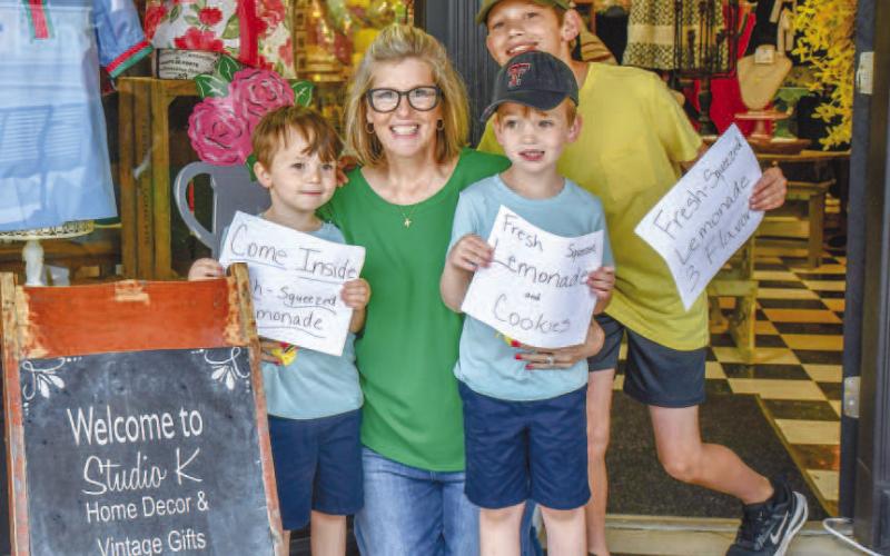 - Pictured from left to right are Brayden Trotter, Kenna Trotter, Brody Trotter, and Bryce Trotter are all smiles at Main Streets Lemonade Day in downtown Levelland on Saturday. (Staff photo by Hannah Woodrum)