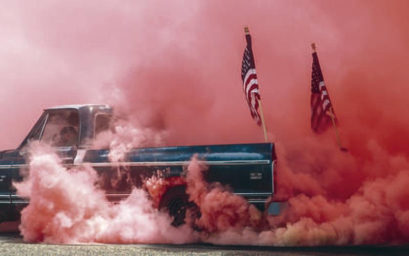 GOD BLESS AMERICA - Brent West was crowned the King of the Hill at the burn out event on Saturday at the Levelland City Park for the Thunder on the Plains event. He dazzled the crowd and judges with not only his burn out but also his pink smoke that drew his performance together. Congratulations Brent West. (Staff photo by Hannah Woodrum)