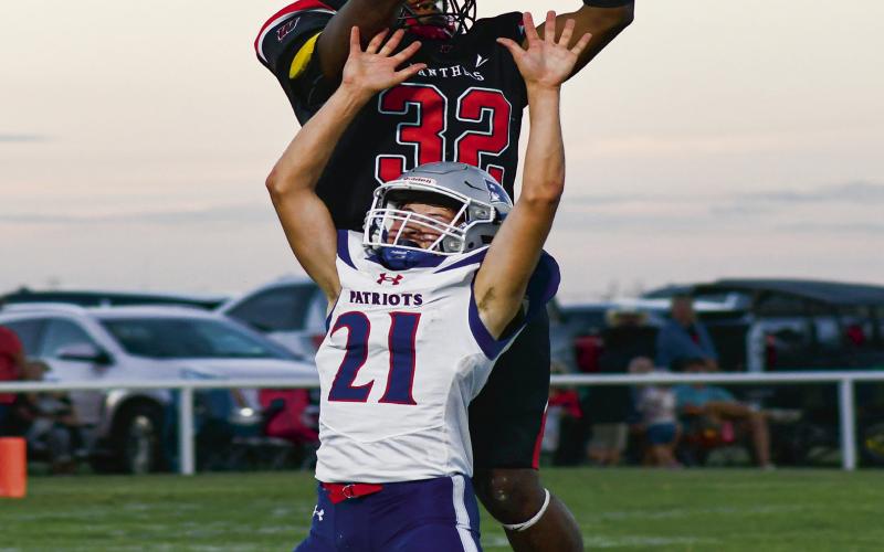 GET MOSSED - Senior Nate Sansom mosses a defender on a contested catch that he would take for a Whitharral Panthers touchdown during their Homecoming game against the Valley Patriots last Friday night. Sansom would score four touchdowns on the night and the Panthers would go on to win 68-48. (Staff photo by Jentezen Smith)