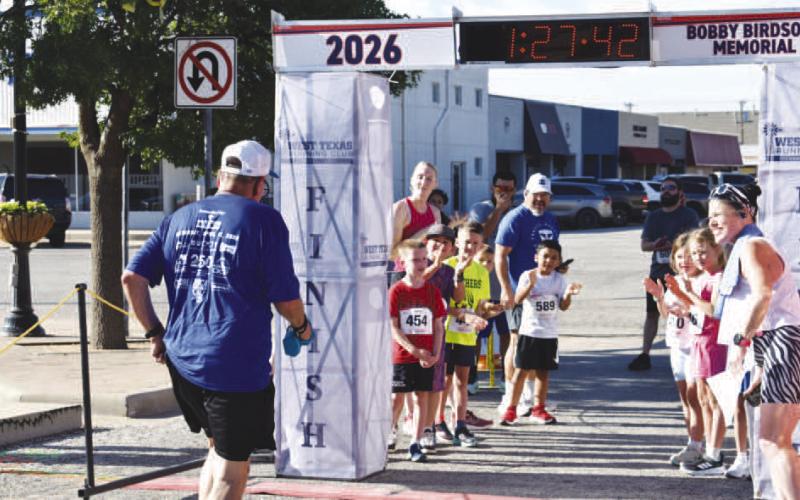 - Participant in the Bobby Birdsong Memorial Mosaic Run 2 Mile brings the race to a close. (Staff photo)