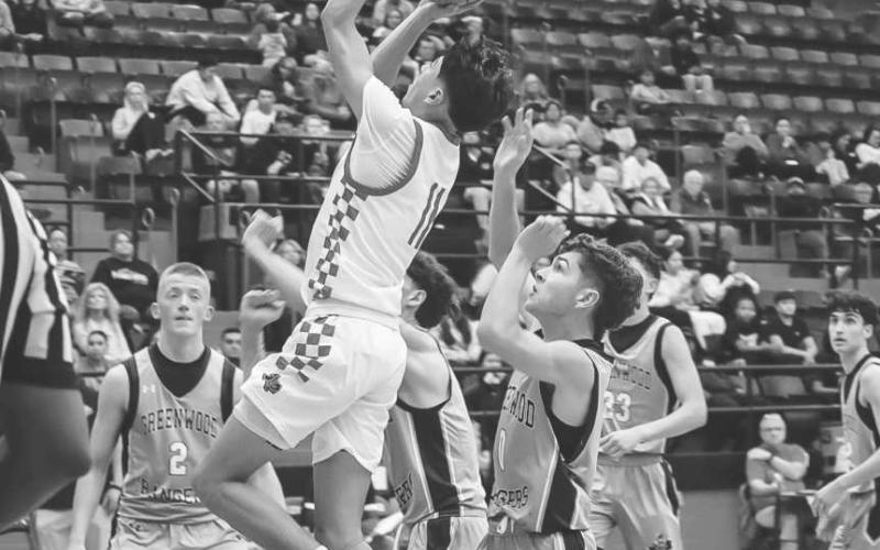 TOO SMALL - Levelland Lobo Jefferey Cisneros rose over the Greenwood defense last Tuesday at home during the team’s win. (Staff photo by Aalijah Soliz)