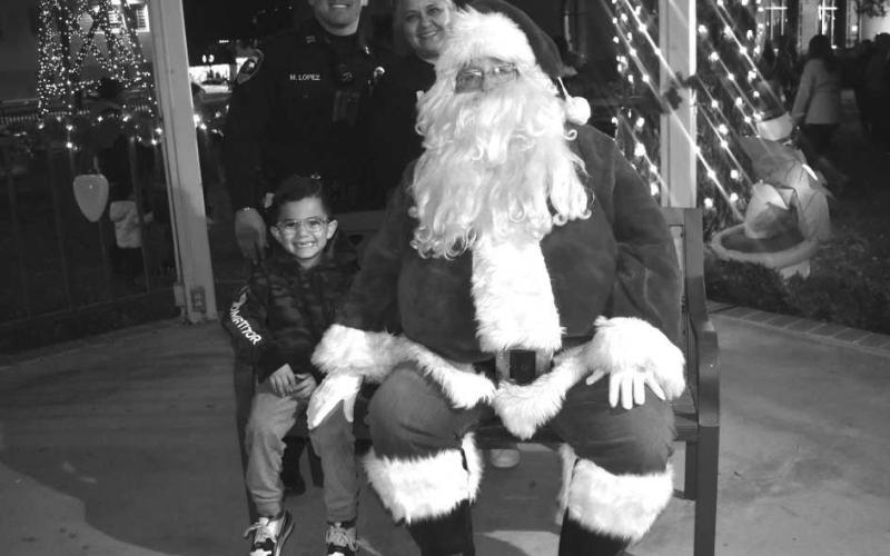 NAUGHTY OR NICE - Santa was at the Gazebo on Hockley County Courthouse lawnThursday evening. Many children participated in seeing Santa and telling him what they want for Christmas. Pictured is the Lopez family who waited their turn to see Santa. (Staff photo by Emily Campos)