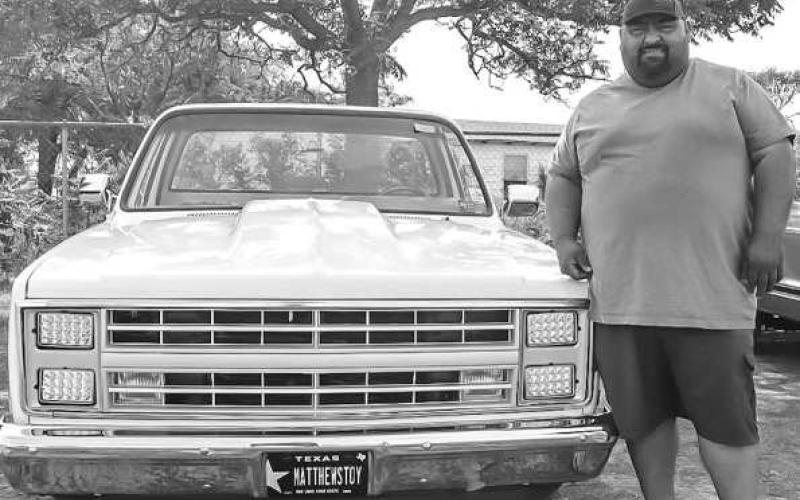NICE WHEELS - The 33rd Annual Juneteenth Celebration was held at L.G. Griffin Park in Levelland over the weekend which also held a car show. The car show was a big attraction last year and gained more traction this year. Pictured is Soloman Hernandez with his 1984 Chevy C10. (Staff Photo by Aalijah Soliz)