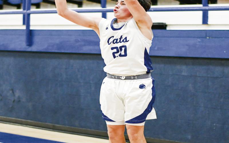MARTINEZ SHOOTS FROM DEEP - Smyer Bobcat Austin Martinez shoots a threepointer during their home game against Sundown this past Friday night. Martinez would lead the Bobcats in scoring in the loss. (Staff photo by Jentezen Smith)