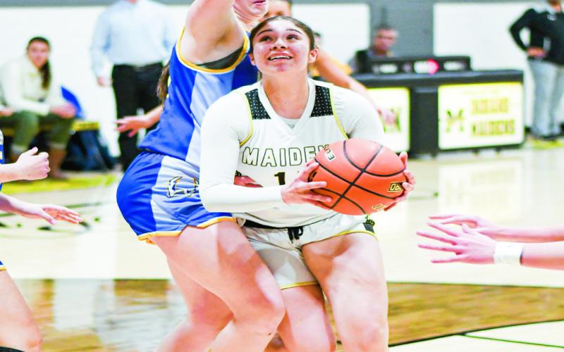 PAINT BATTLE - Morton’s Ada Torres and Whiteface’s Keyarah Castaneda battle in the paint during their district basketball game this past Tuesday at Morton High School. (Staff photo by Jentezen Smith)