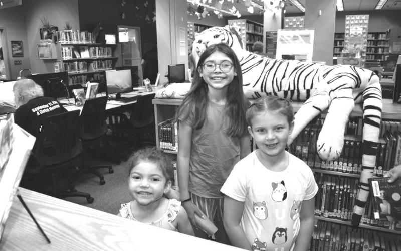 LIBRARYTIME- Pictured are Yazi Mendez, Alexander Mendez and Payton Elmore who participated in the Hockley County Library Summer Program on Wednesday. (Staff photo by Emily Campos)