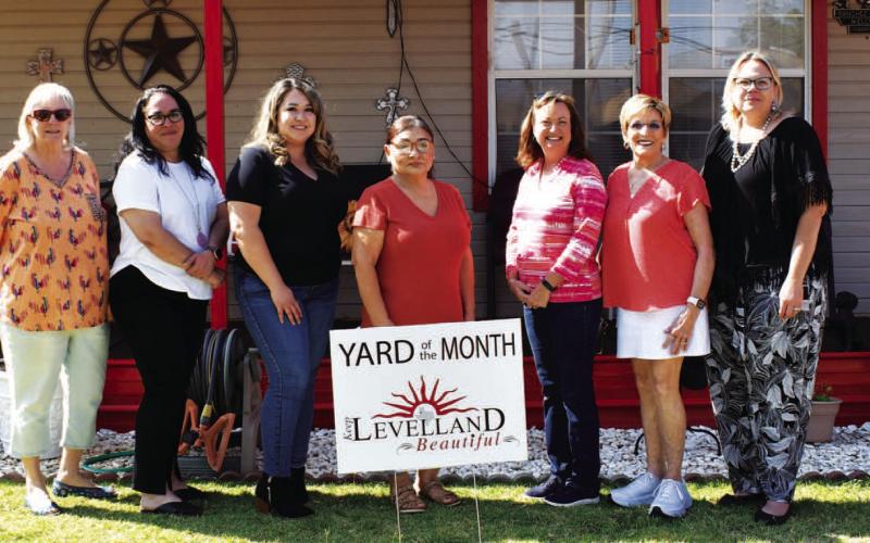 YARD OF THE MONTH - August yard of the month was awarded to Victor and Alice Sanchez by the Keep Levelland Beautiful. Pictured from left to right are: Donna Wheeler, Janie Morales, Stephanie Rodriguez, Alica Sanchez home owner, Tammy Franklin, Barbra Pinner and Kelly Hancock. (Staff photo by Emily Campos)