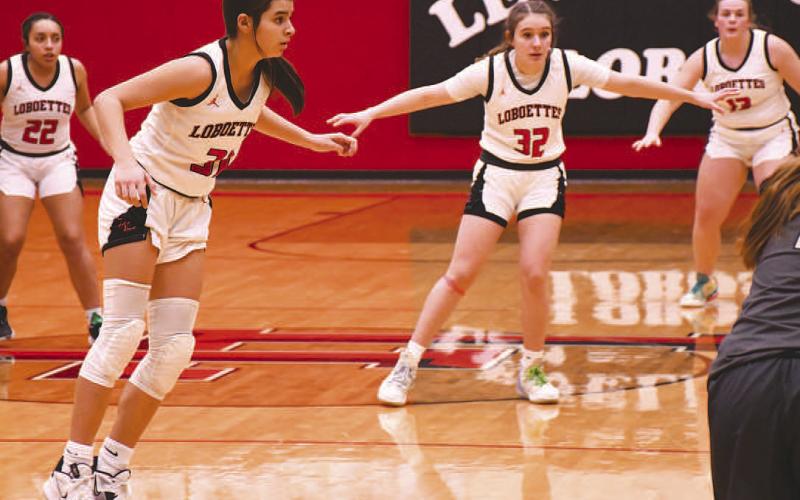 ON A STRING- The Lobboettes have hung their hats on defense this season and continued to be suffocating defensively against Big Spring in district action Tuesday. The Lady Steers were held scoreless in the first quarter and had three points going into halftime. Pictured on defense are Olivia Velardez, Leilani Sanchez, Emery Smith and Laci White. (Photo Courtesy of Edward Ramirez)