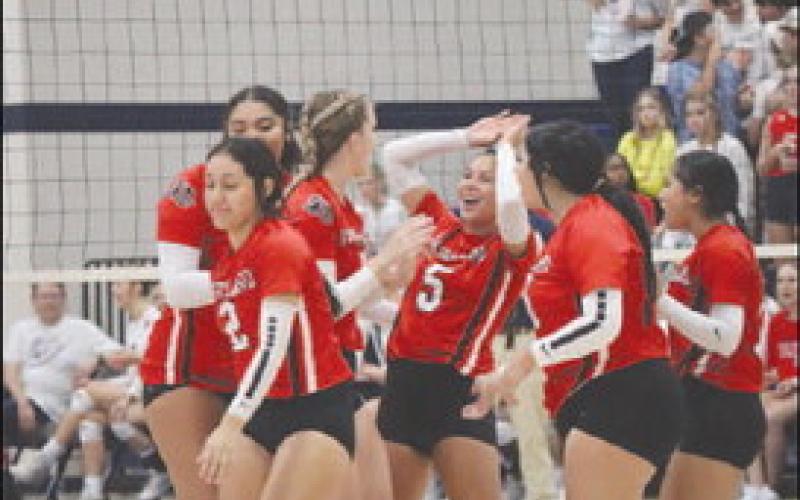 TEAMWORK - Levelland celebrated after the team make a great effort on the ball and got the crucial point. (Staff photo by Aalijah Soliz)