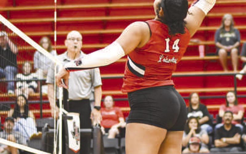 SPIKE IT – Senior Trinity Wafer goes up for the spike during a volleyball game against Plains this past Tuesday at Levelland Highschool. (Staff photo by Jentezen Smith)