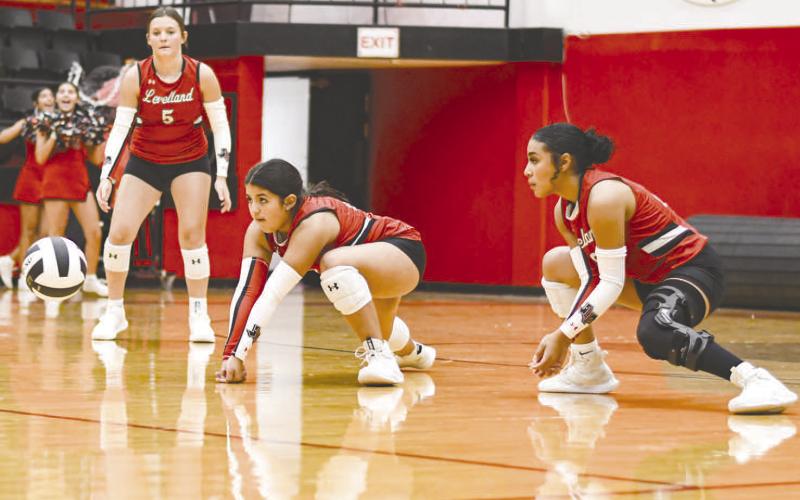 ON THE DIG – Freshman Karsyn Gaona makes the dig while teammates Tiffany File and Mia Sepulbeda stay ready to help during a volleyball game against Plains this past Tuesday at Levelland Highschool. (Staff photo by Jentezen Smith)