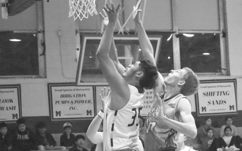 TOUGH LAY UP - Morton Indian Anibal Casteneda grabbed the offensive rebound and went back up through the contact during the teams game last Friday against the Lubbock Titans at home. (Staff photo by Aalijah Soliz)
