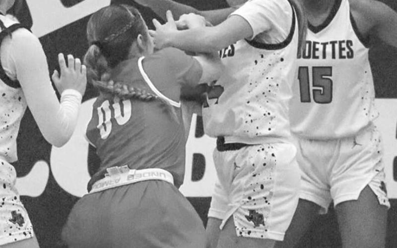GRIT - Levelland Loboette Kaylee Penner fought for the jumpball during the teams district win against the Sweetwater Lady Mustangs this past Tuesday. (Staff photo by Aalijah Soliz)
