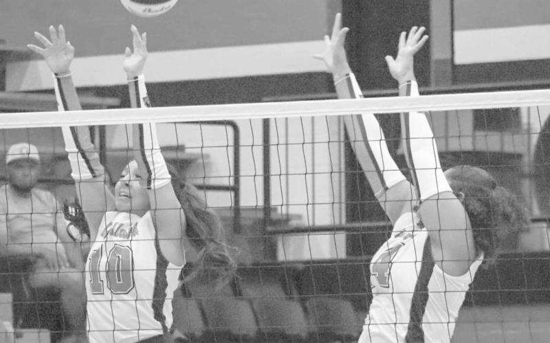 VERTICAL - Levelland Loboettes Mia Morin and Trinity Wafers jumped high to block the Denver City shot this past Tuesday during the team’s season opener at home. (Staff photo by Aalijah Soliz)