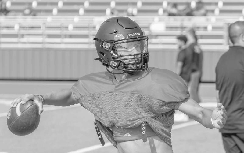SPIRAL - Levelland Lobo Boston Winfield threw the ball during quarterback drills this past week during the team’s two-a-day drills at Lobo Stadium. (Staff photo by Dom Puente)