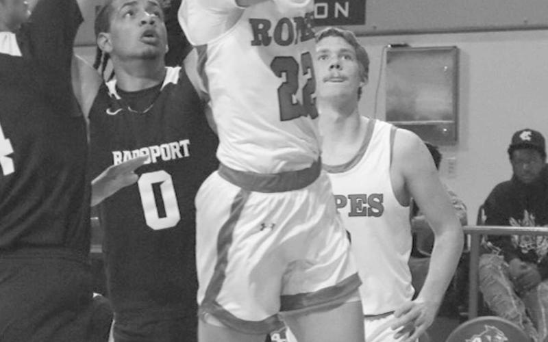 AND-ONE - Ropes Eagle Reese Williams layed the ball up through the double team in the team’s State Semi-Final round of the playoffs at ACU. (Staff photo by Aalijah Soliz)
