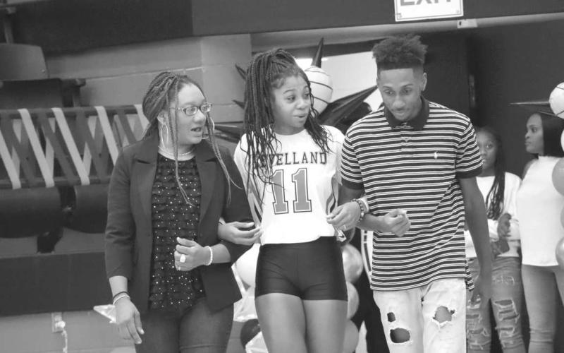SENIOR NIGHT - Levelland Loboette Tanaeasia Brackens was escorted onto the court this past Tuesday during Senior Night by her mother Evelyn Brackens and her brother Tylynn Brackens. After graduation Tanaeasia plans to attend Baylor University to pursue a degree in nursing. (Staff photo by Aalijah Soliz)