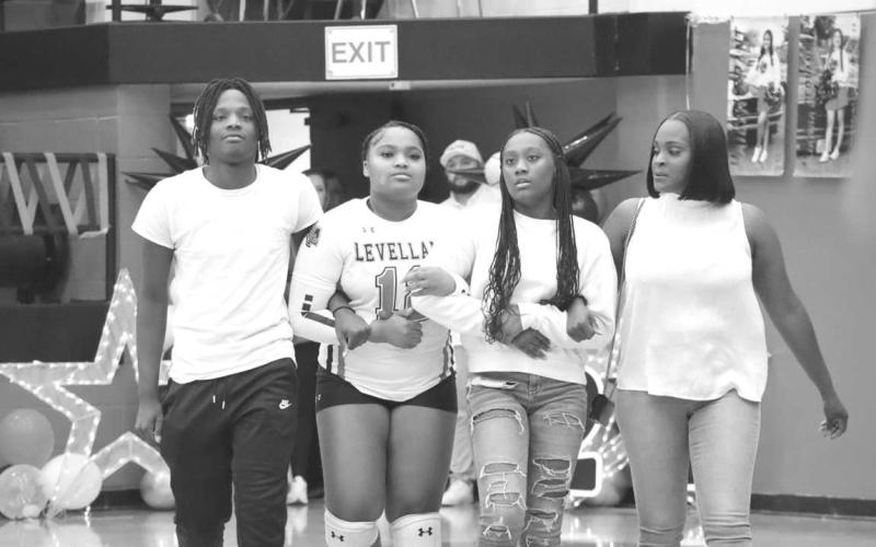 SENIOR NIGHT - Levelland Loboette Zoe Jordan was escorted onto the court by her mother Lace Johnson and her siblings Elijah and Khloe Jordan last Tuesday during Senior Night. Zoe plans on attending Baylor University to pursue a degree in Biology and then going on to medical school to become a neurosurgeon. (Staff photo by Aalijah Soliz)