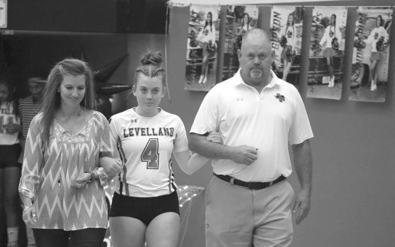 SENIOR NIGHT - Levelland Loboette walked out last Tuesday on Senior night with her parents Mike and Amie Stafford escorting her on the court. After graduation Maddie plans on attending South Plains College and will then transfer to Texas Tech to pursue a degree in nursing. (Staff photo by Aalijah Soliz)