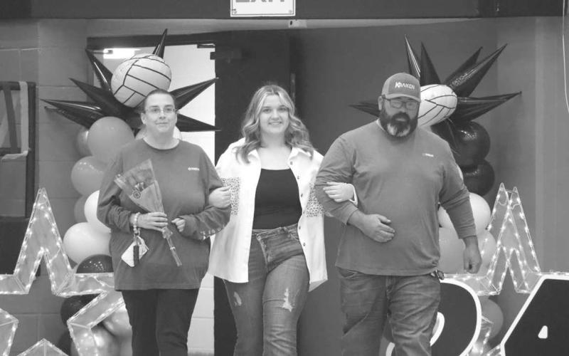 SENIOR NIGHT - Levelland manager Ashton Marinelarena walked out last Tuesday with her parents escorting her, Art and Jennifer Marinelarena. After graduation Ashton would like to attend SPC to pursue a degree in Radiologic Technology and become a radiation therapist. (Staff photo by Aalijah Soliz)