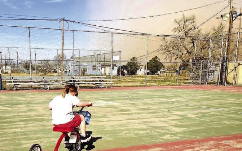 Temperatures dropped this past weekend bringing back the chill of winter as a cold front moved into Hockley County with high wind and dust storms to the area for a few days. Beverly Ann Varner, granddaughter of Rob Alcazar, was intent on playing at Levelland Skate Park as dust descended on the city. (Photo courtesy Rob Alcazar)