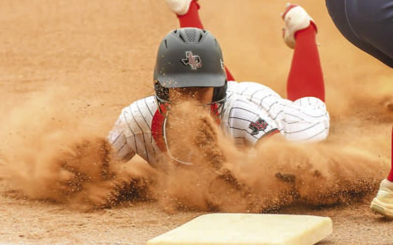 AGGRESSIVE BASE RUNNING - Loboette Madilyn Barrientes stole two bases during their district game against the Liberty Lady Patriots. Pictured is Barrientes beating the throw down to third. She would eventually score after a single. She was also 1-2 at the plate and had one RBI. (Staff photo by Dom Puente)