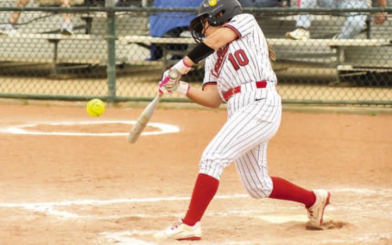 LONG BALL - Loboette Delany Delgado had a field day at the plate recording a home run to center during their district match up against the Liberty Lady Patriots, Tuesday. Delgado recorded two hits including the home run and had 3 RBI’s and also forced a walk. The Loboette's run ruled the Lady Patriots 16-1 in three innings. (Staff photo by Dom Puente)