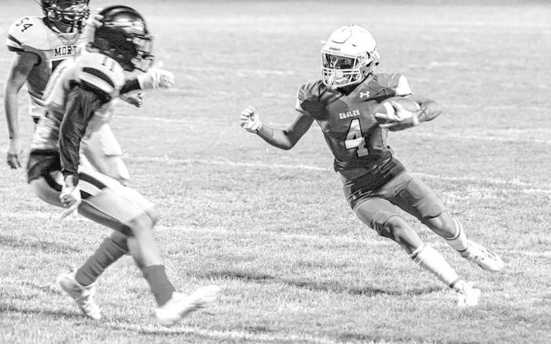 CATCH AND MOVE- Mason Marmolejo scored a Ropes touchdown after he pulled down a pass and used a nice move to get past a defender in a win against Morton last Friday. The Eagles continued their season against Seagraves Friday. (Photo Courtesy of Donovan Martin)